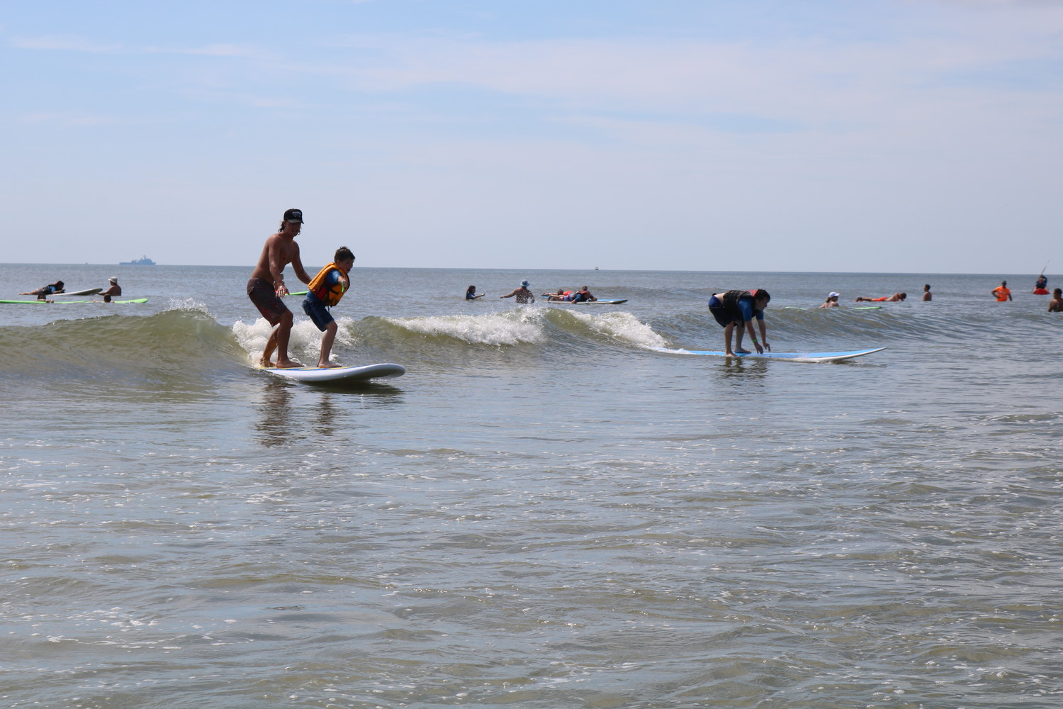 Local children and young adults with autism and related disabilities surf at the HEAL Foundation’s 13th annual surf camp held June 26-27 in Neptune Beach.